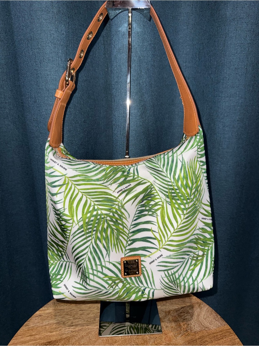 This is a Dooney & Bourke Siesta Key Bryce palm-leaf hobo bag